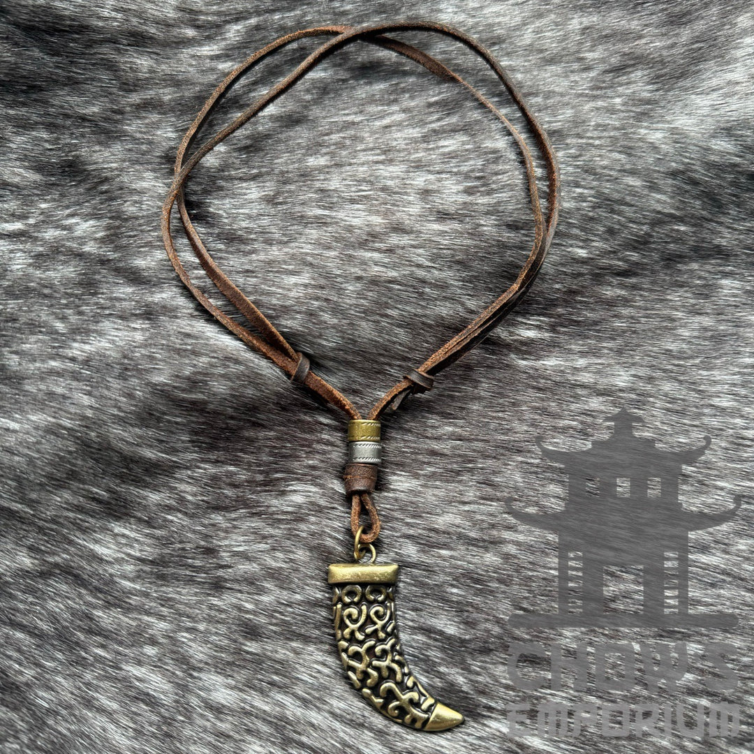 LARP Celtic tooth necklace with ornate bronze design, brown leather cord.