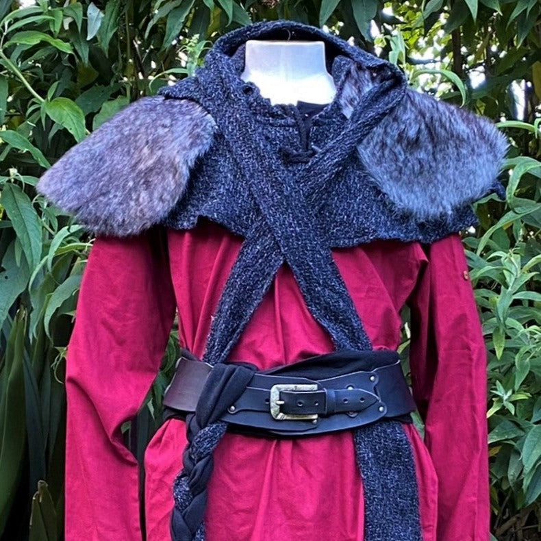 Medieval LARP outfit close-up: red tunic, grey mantle, fur trim, braided belt.