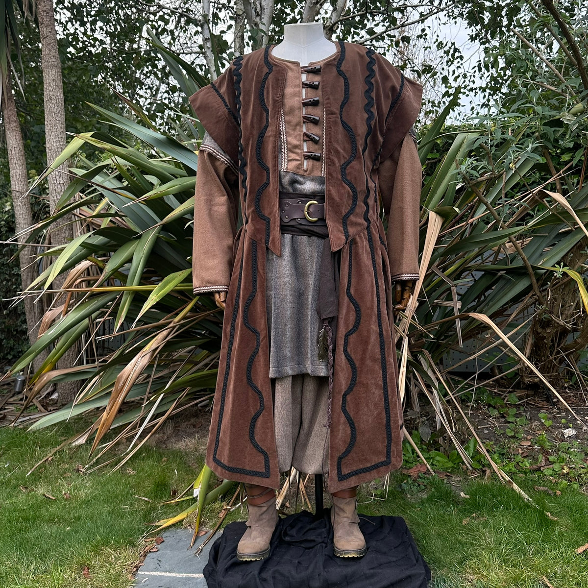 LARP outfit with brown patterned coat, front view, woodland backdrop.