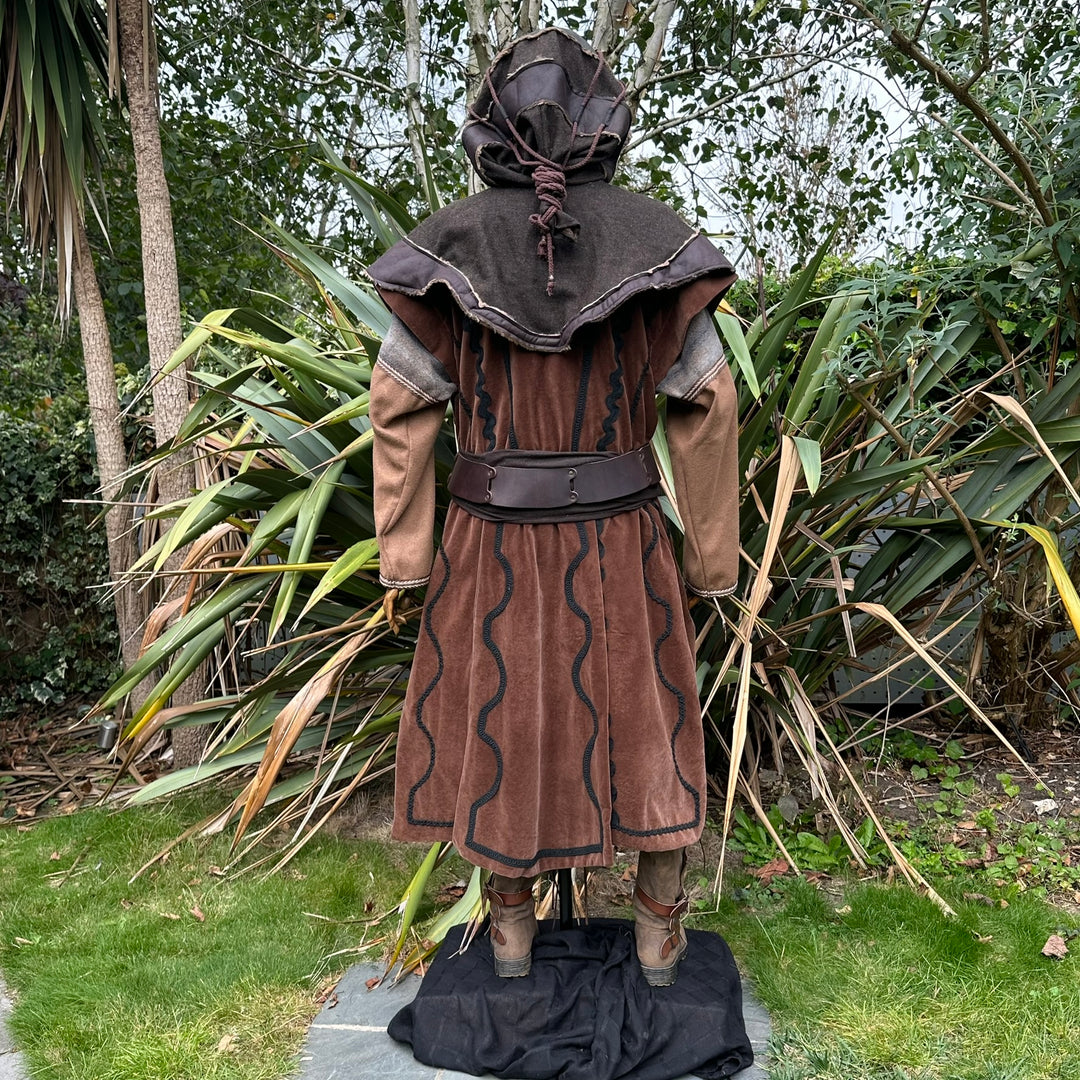Back view of medieval LARP costume; brown waistcoat, hood, and sash.