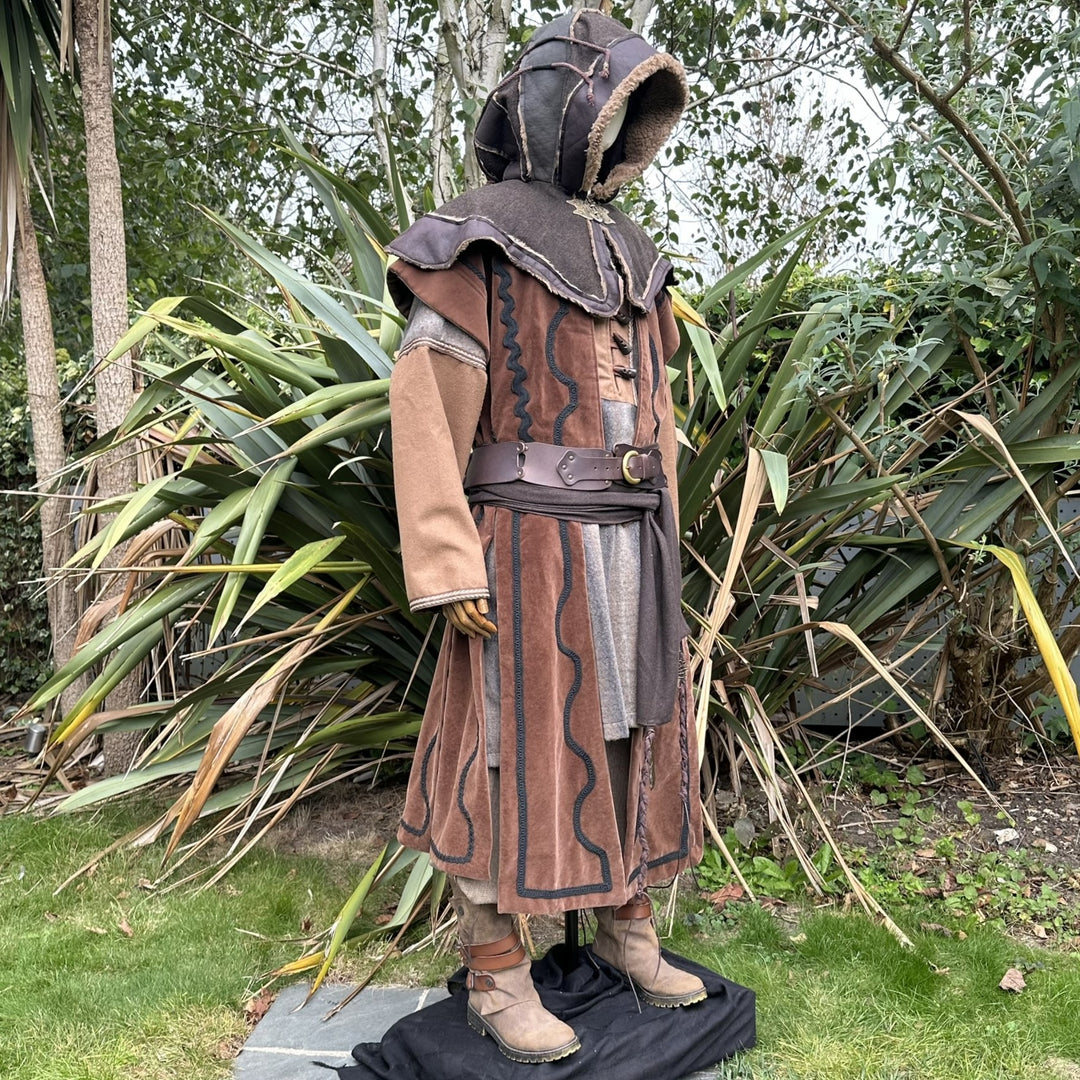 Mannequin in medieval LARP attire with hood, waistcoat, and boots.