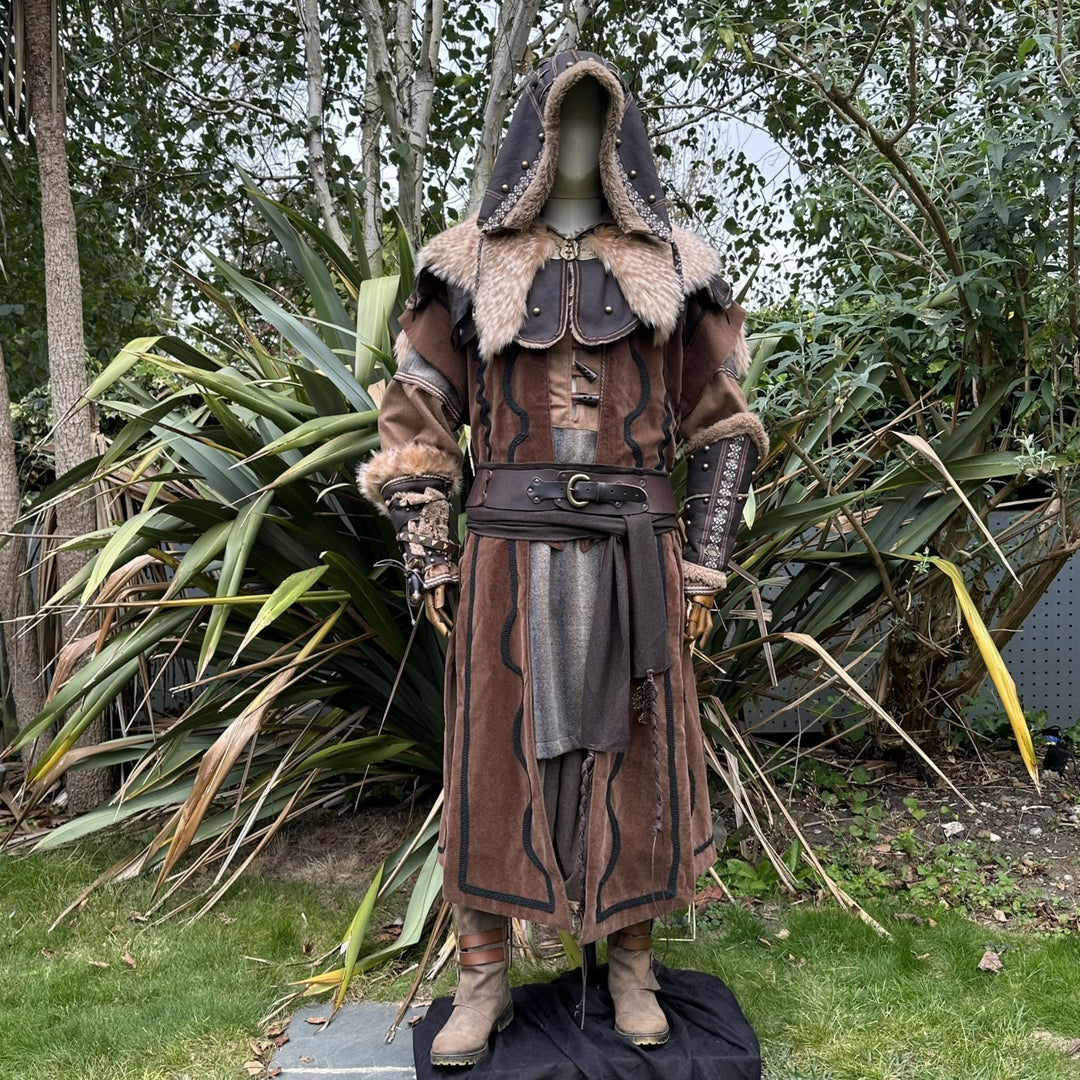 Mannequin in ornate medieval LARP hood, brown with fur trim, forest backdrop.