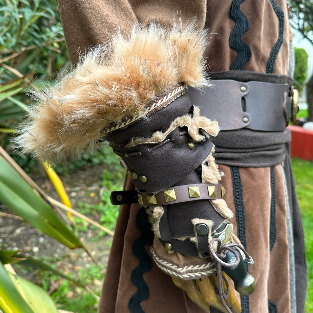 Fur-lined vambrace close-up on LARP costume with ornate details.