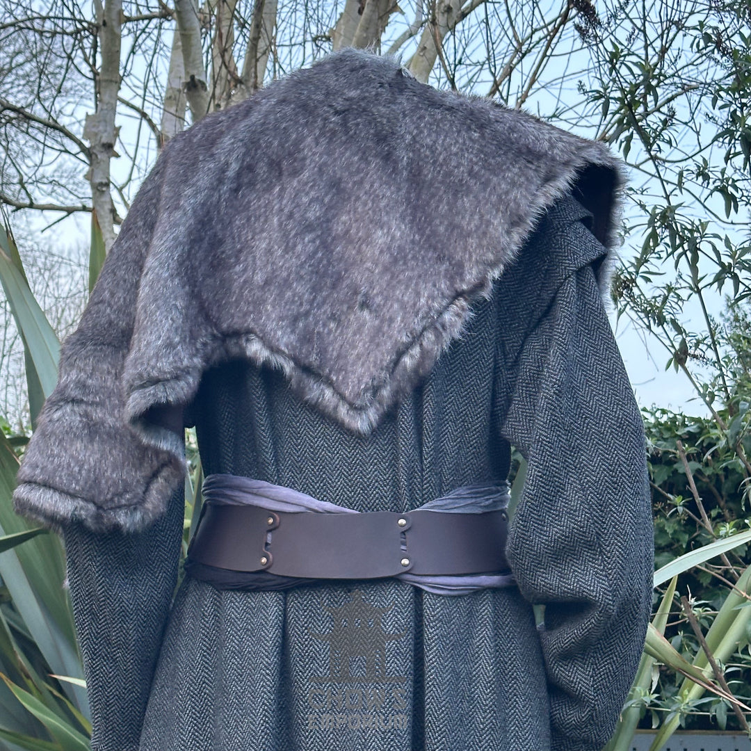 Grey fur mantle draped over medieval gown, viewed from the back.
