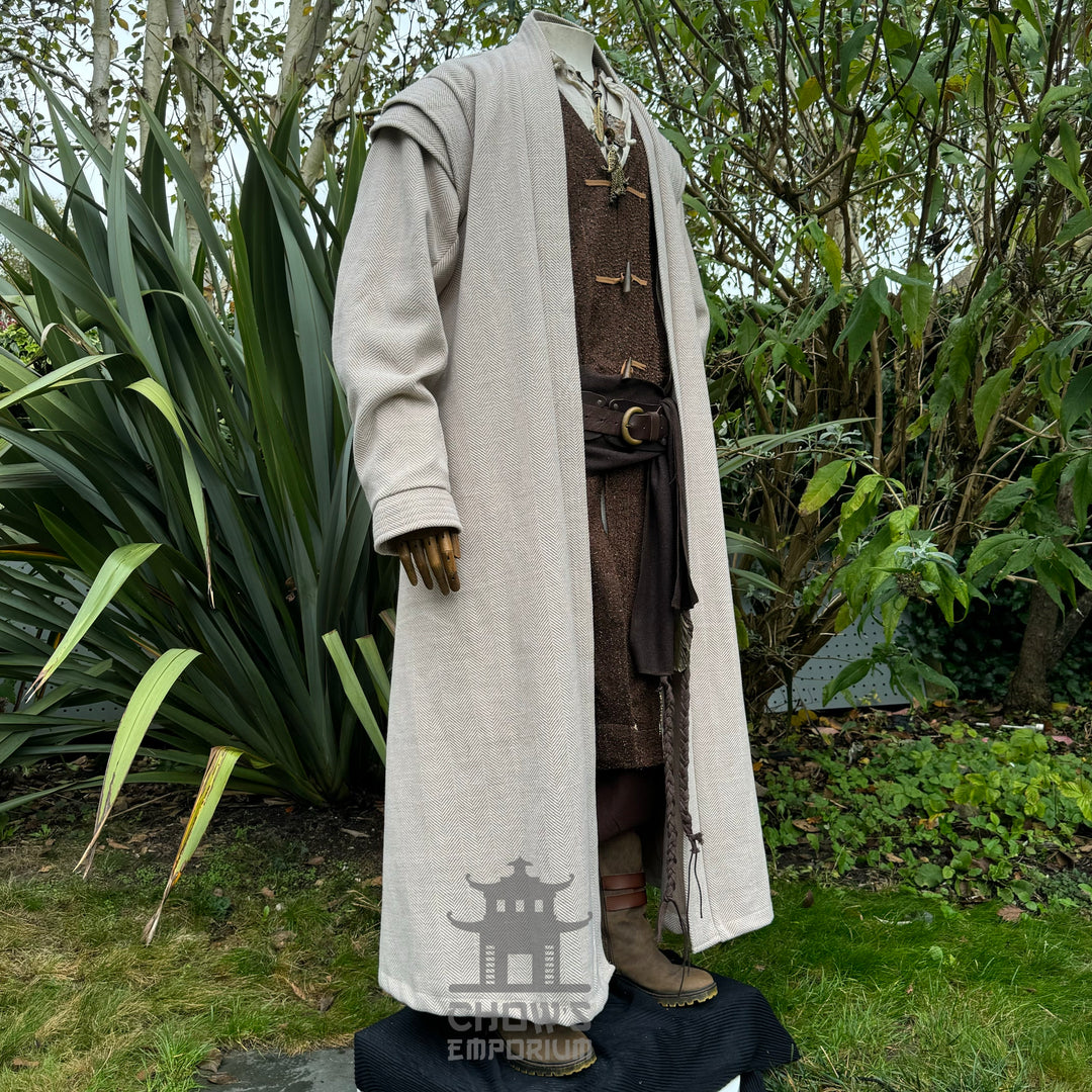 Medieval LARP robe in beige herringbone fabric with brown trim, noble fantasy cosplay costume.