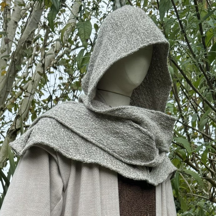 Oatmeal wool scarf hood for LARP, side view among trees.