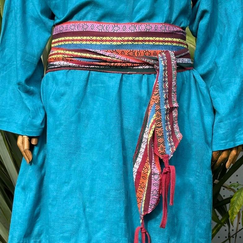 Multi stripe pirate sash draped over blue medieval tunic for LARP events.
