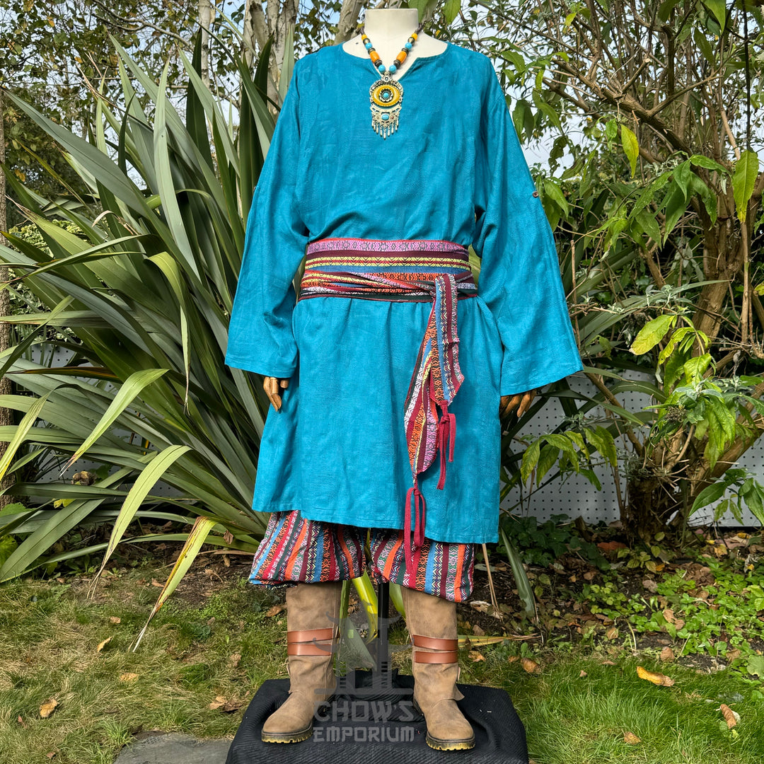 3 piece outfit with blue tunic and multi striped trousers and sash.