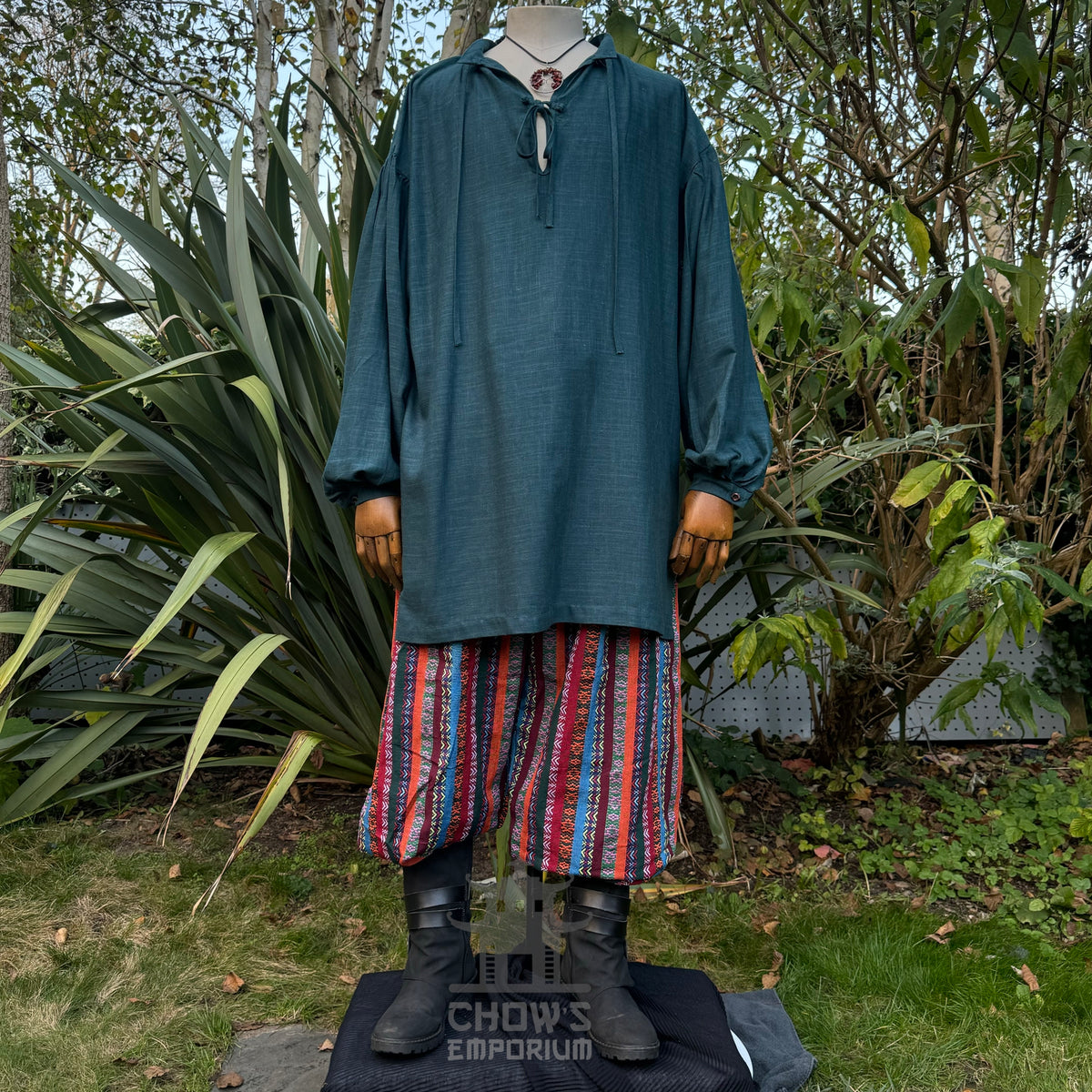 LARP basic outfit with teal medieval shirt, patterned pants, and sash.