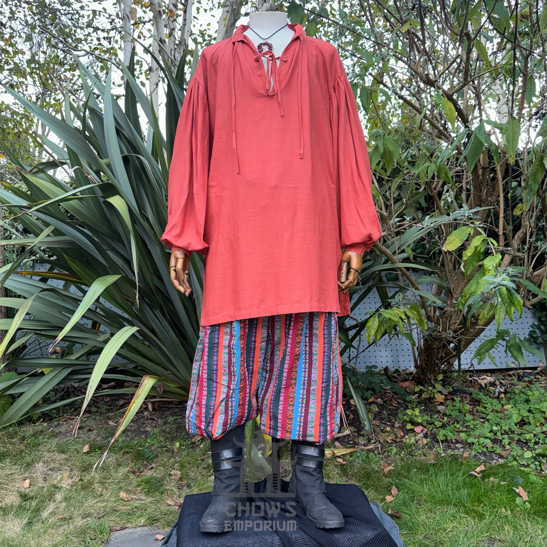 LARP basic outfit with orange medieval shirt, striped pants, and sash. Front view.