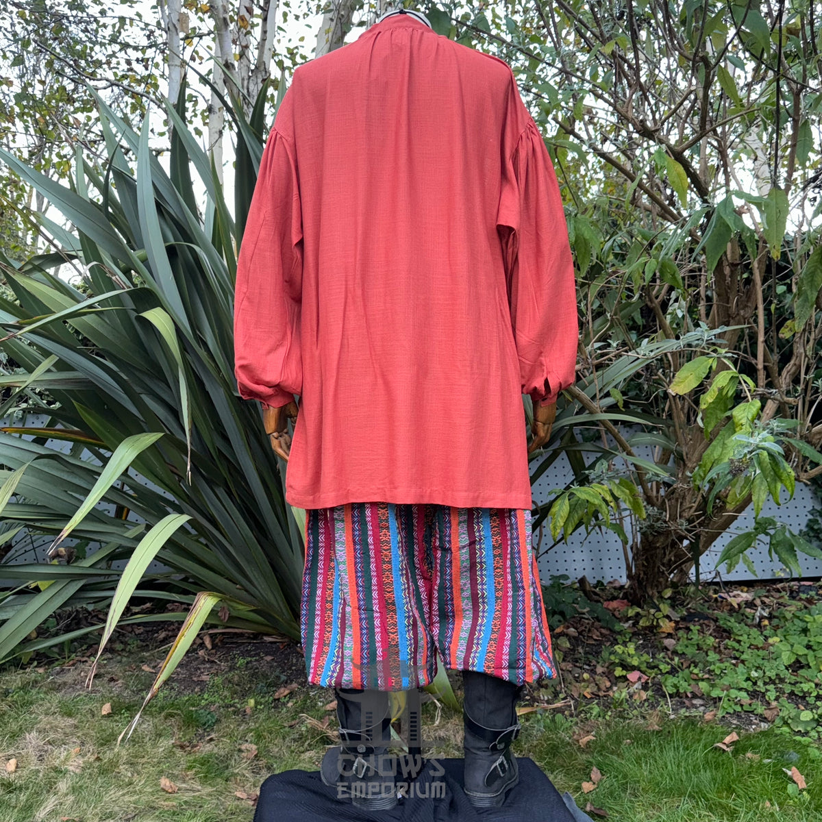 LARP basic outfit, orange medieval shirt, striped pants, rear view.
