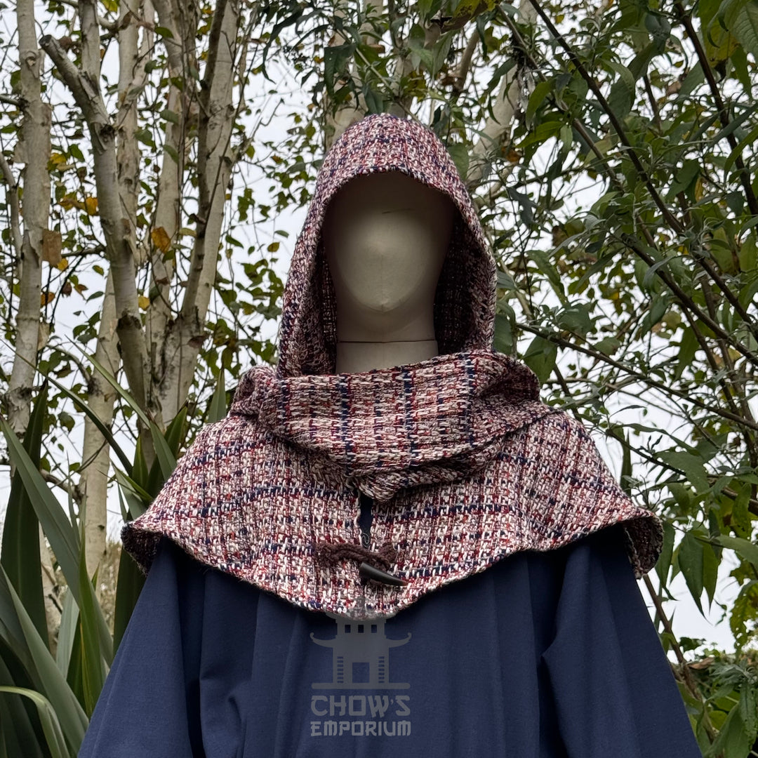 Tricolour wool scarf hood for LARP, front view against trees.