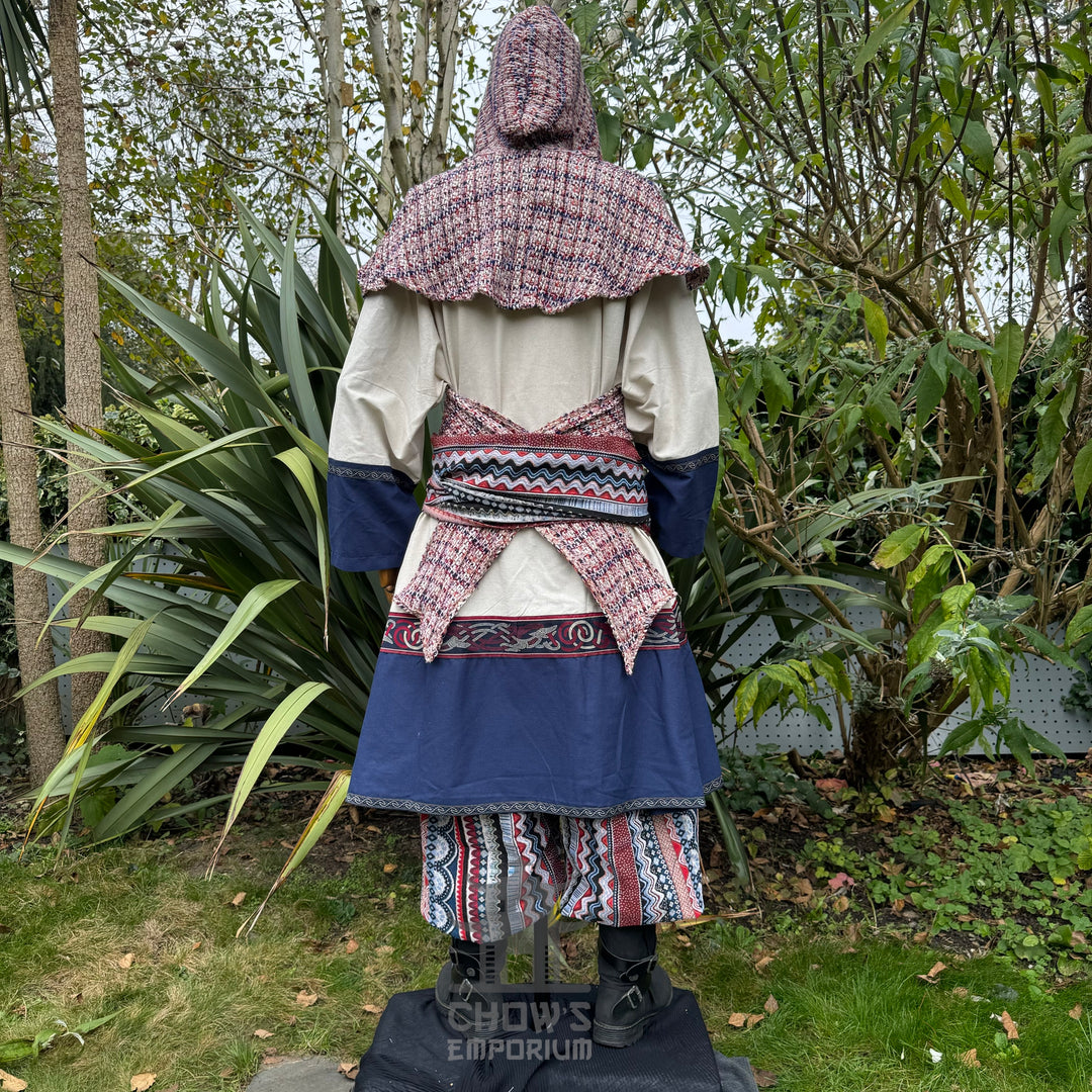 Back view of LARP archer set with blue tunic, patterned hood, sash, and pants.