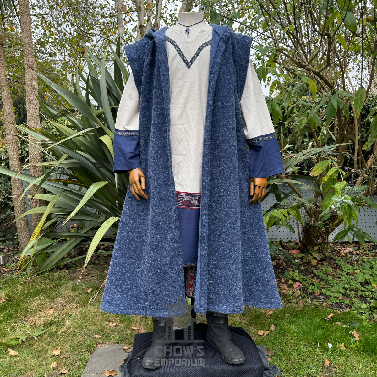 Blue hooded sleeveless robe, textured fabric, front view.