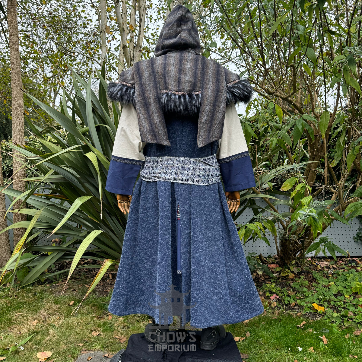 Medieval LARP outfit back view, featuring blue hooded waistcoat, wrap around hood, tunic and sash.
