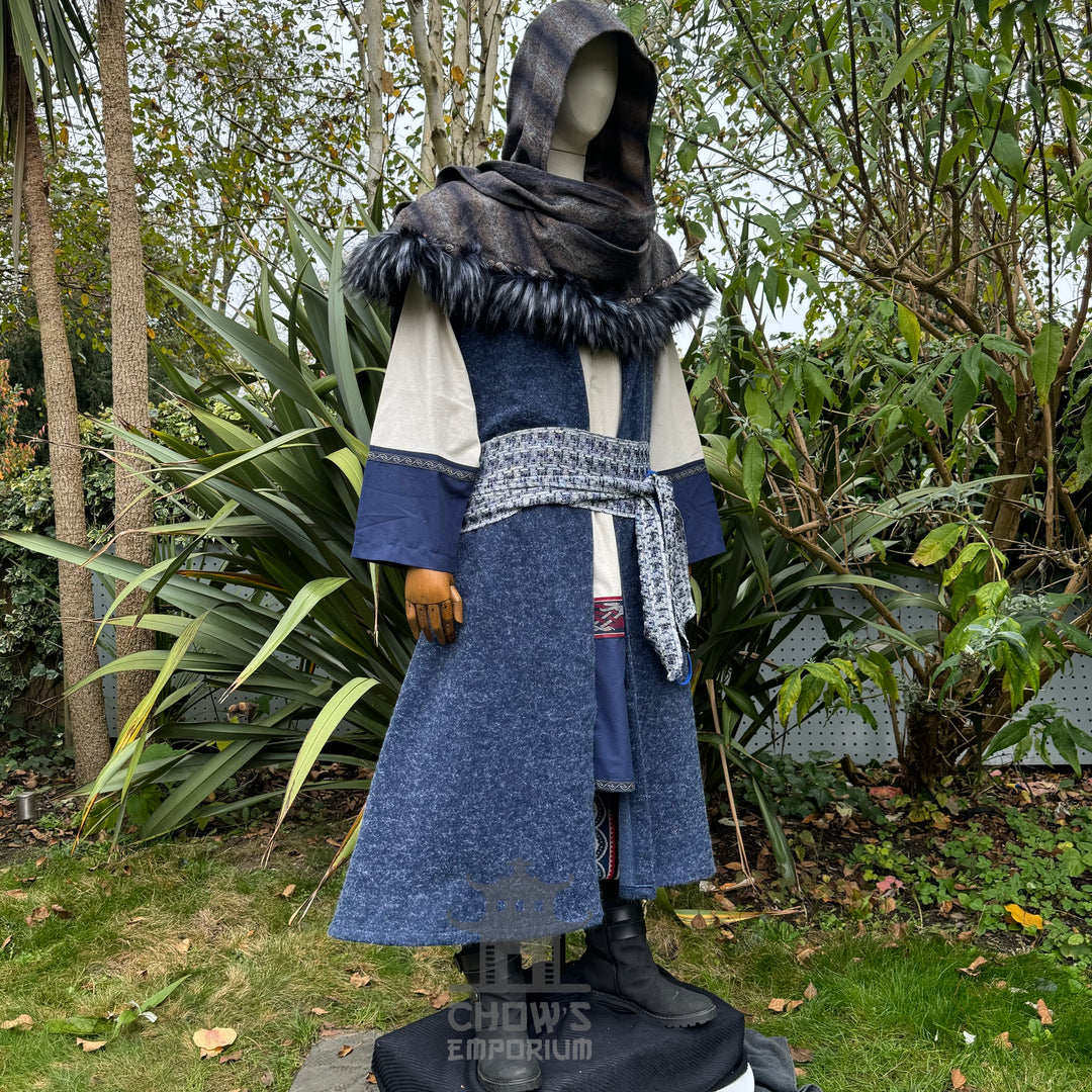 Medieval LARP outfit side view, featuring blue hooded waistcoat, wrap around hood, tunic and sash.