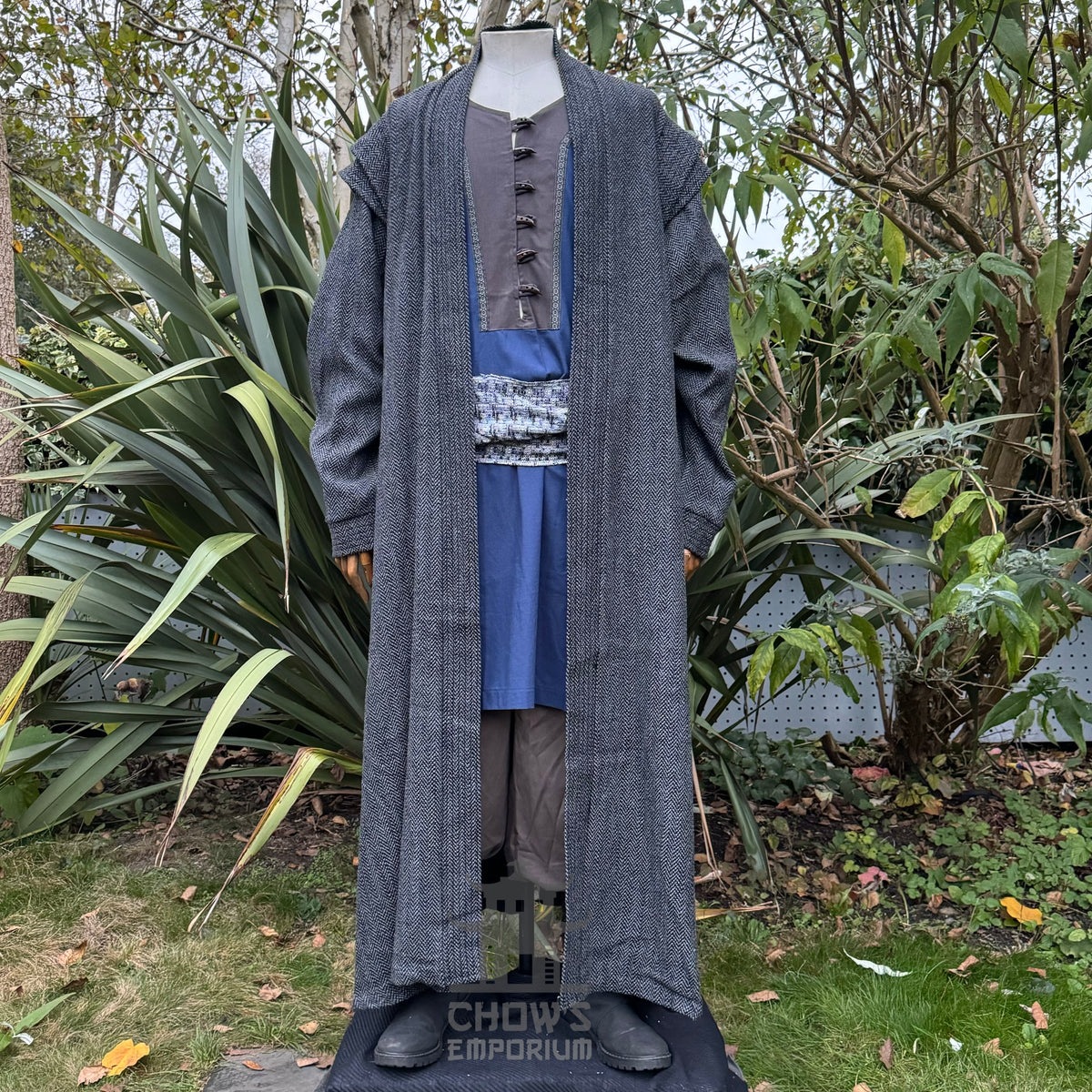 LARP medieval sorcerer outfit in garden; grey robe and blue sash front view.