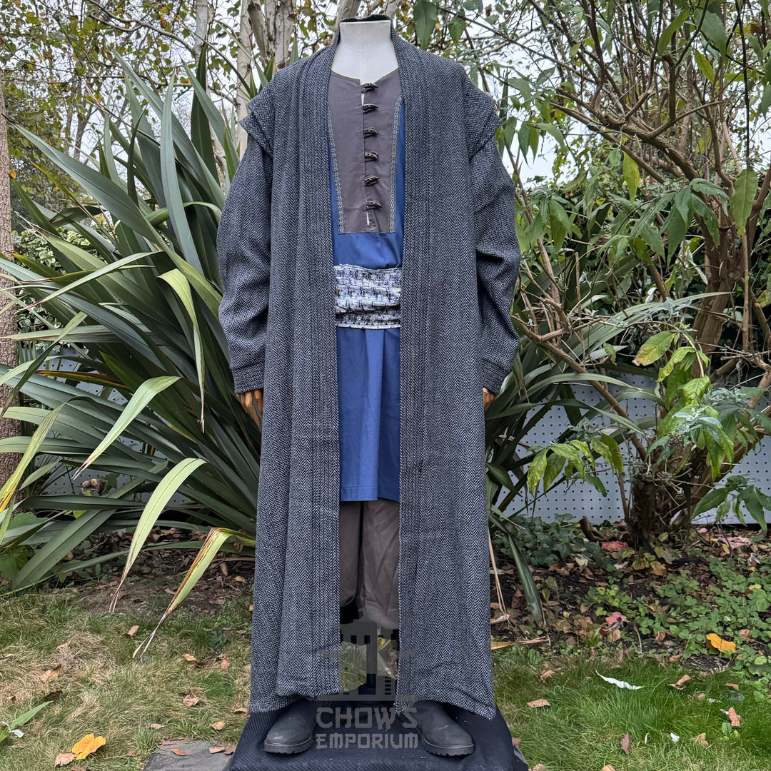 LARP medieval sorcerer outfit in garden; grey robe and blue sash front view.