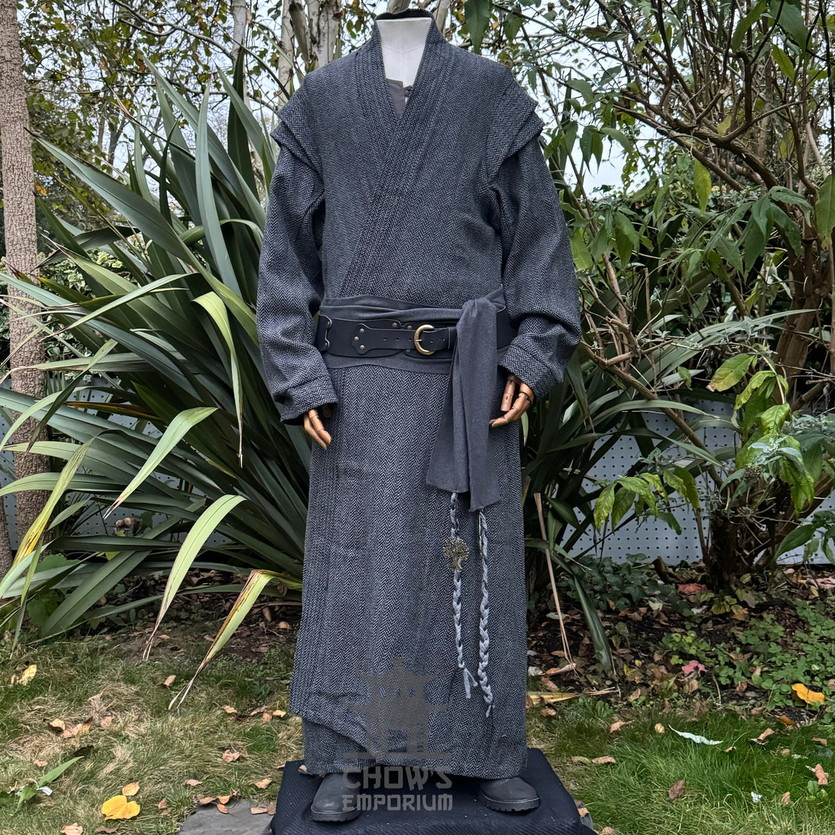 Medieval LARP outfit, garden view: grey robe, detailed belt, wooden mannequin.