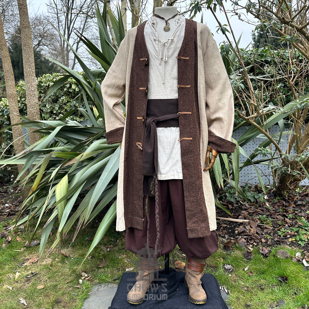 Rustic LARP outfit with beige coat, tunic, trousers, belt, and necklace.