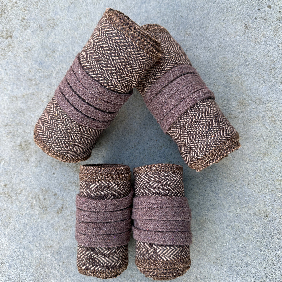 Dark brown herringbone wool wraps for LARP, angled view, folded neatly.