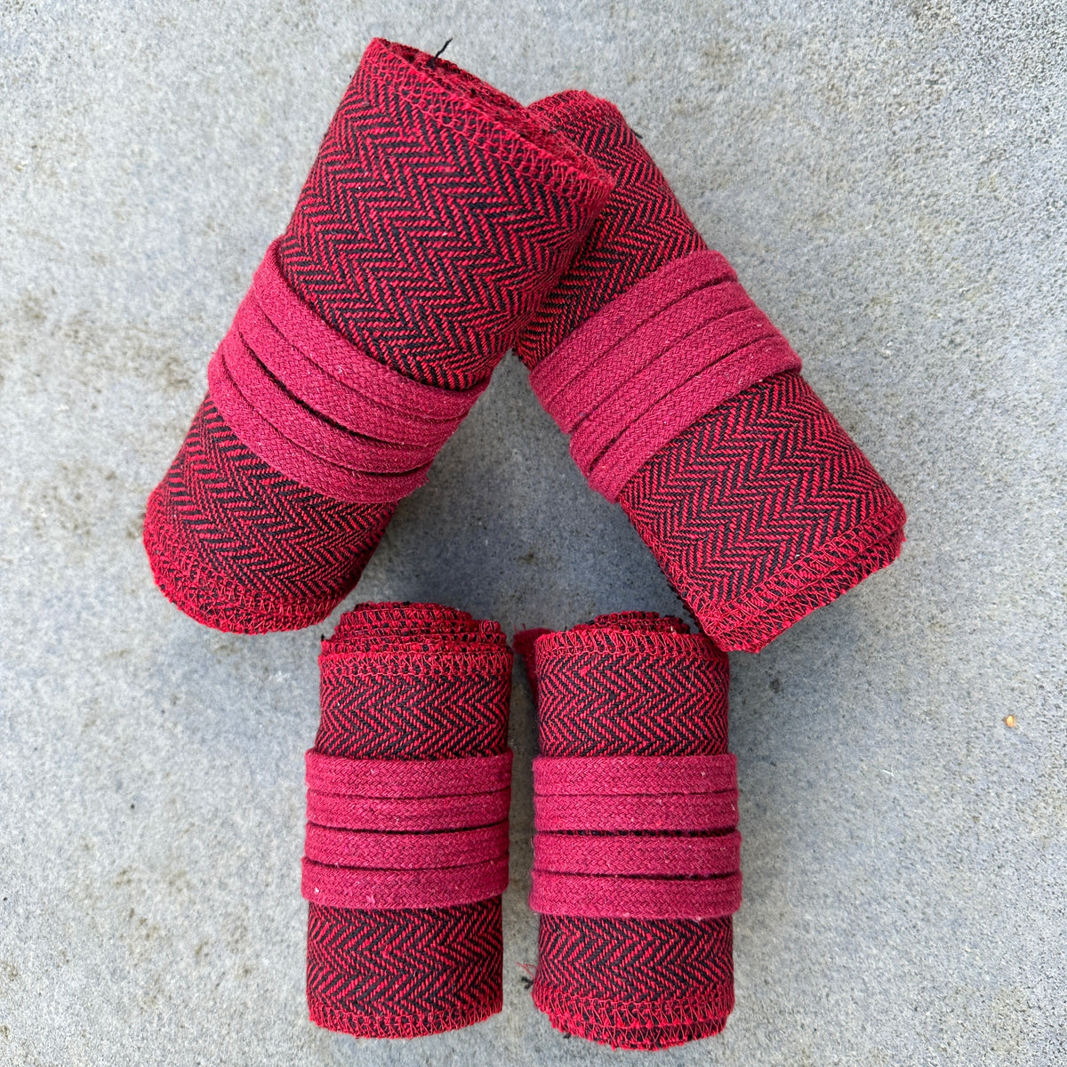 Red herringbone wool wraps for arms and legs, ideal for medieval LARP.