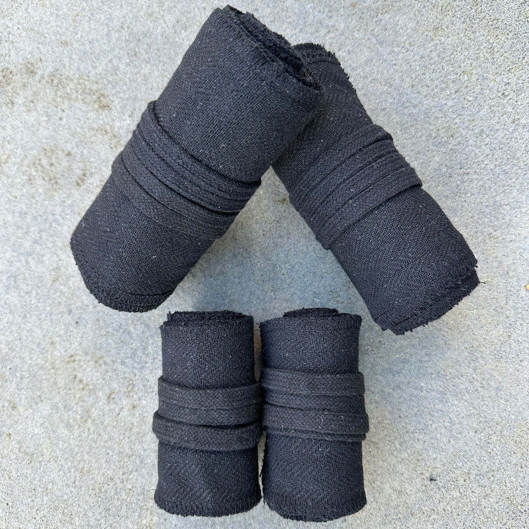 Black herringbone wool leg and arm wraps, perfect for medieval LARP.