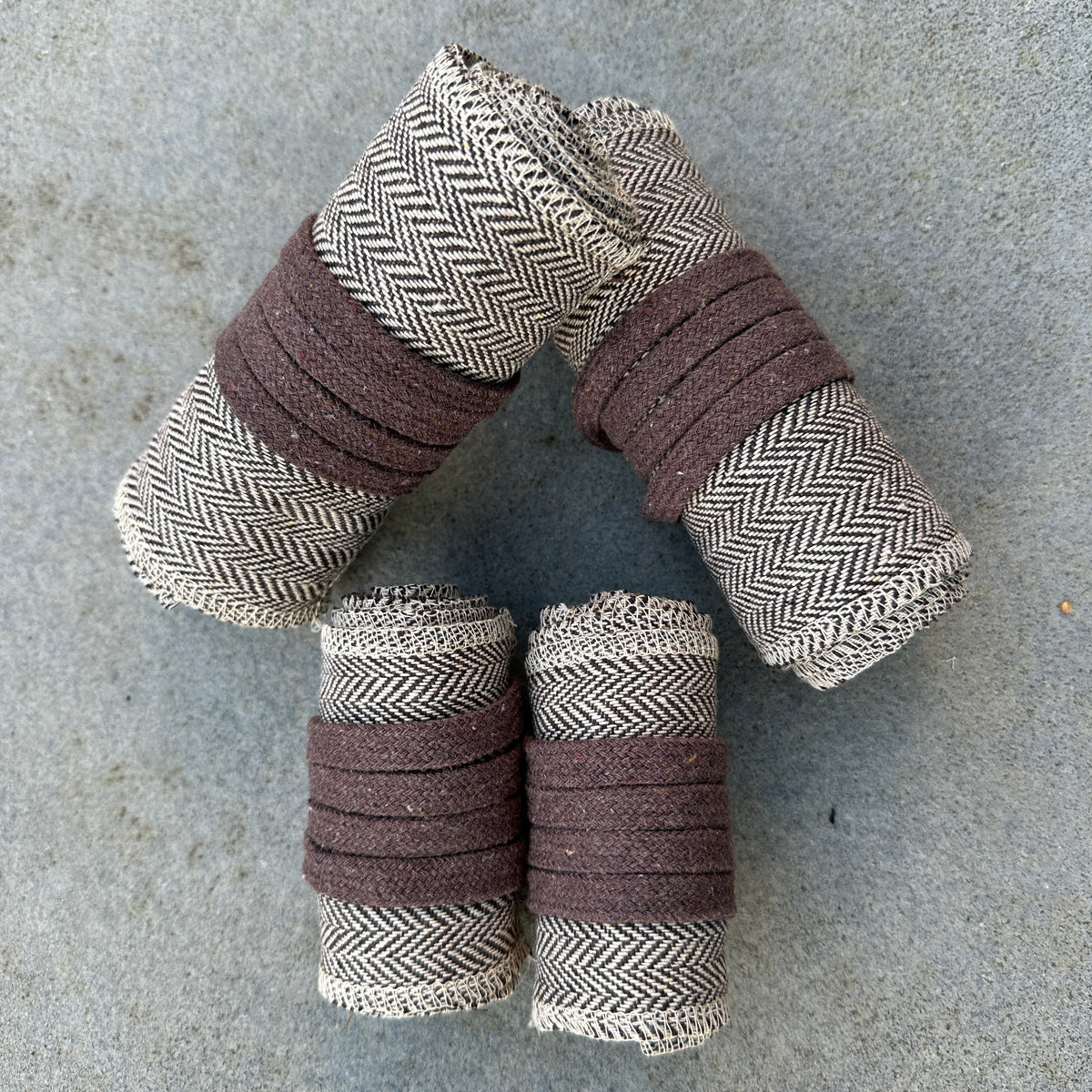 Light brown herringbone wool leg and arm wraps for medieval LARP.