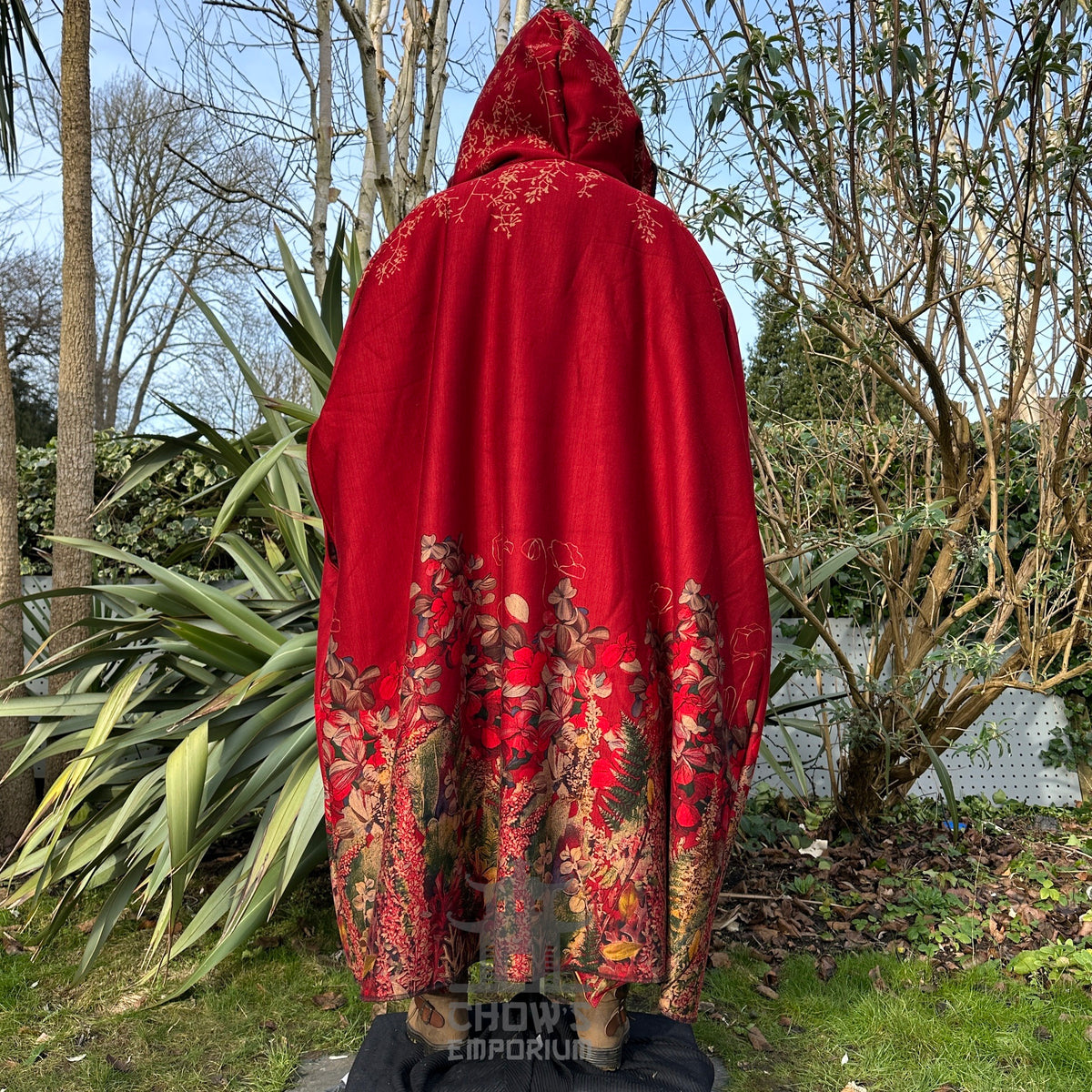 Rear view of red LARP cloak with floral embroidery, medieval.