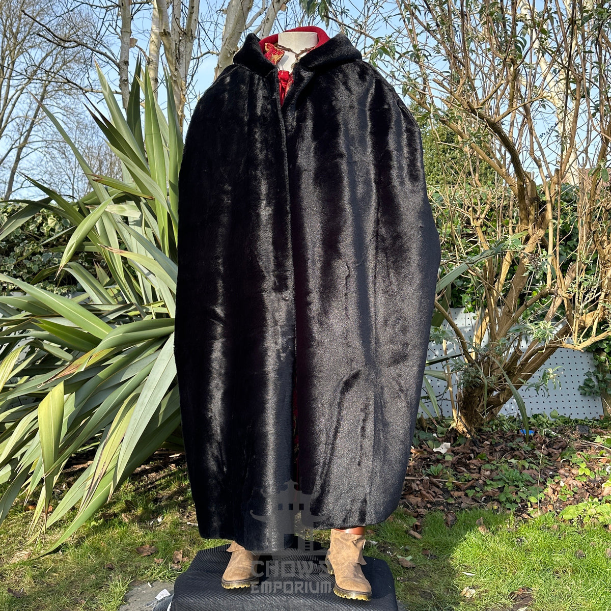 Black fur medieval LARP cloak outdoors with boots visible at bottom.