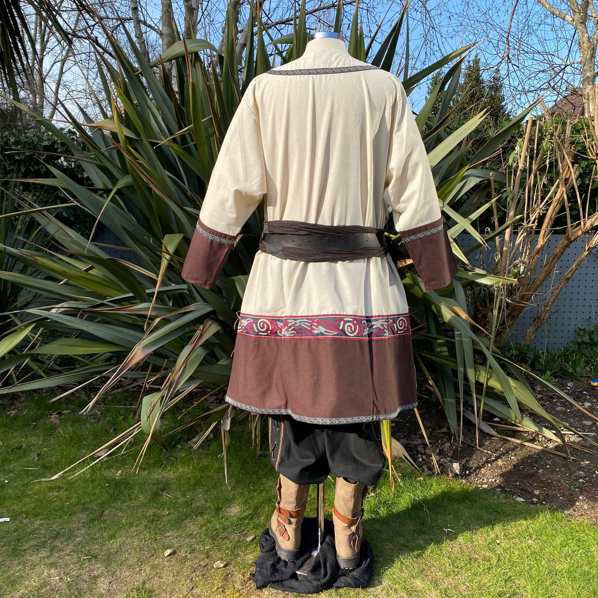 Back view of medieval LARP tunic with brown accents and embroidered trim.