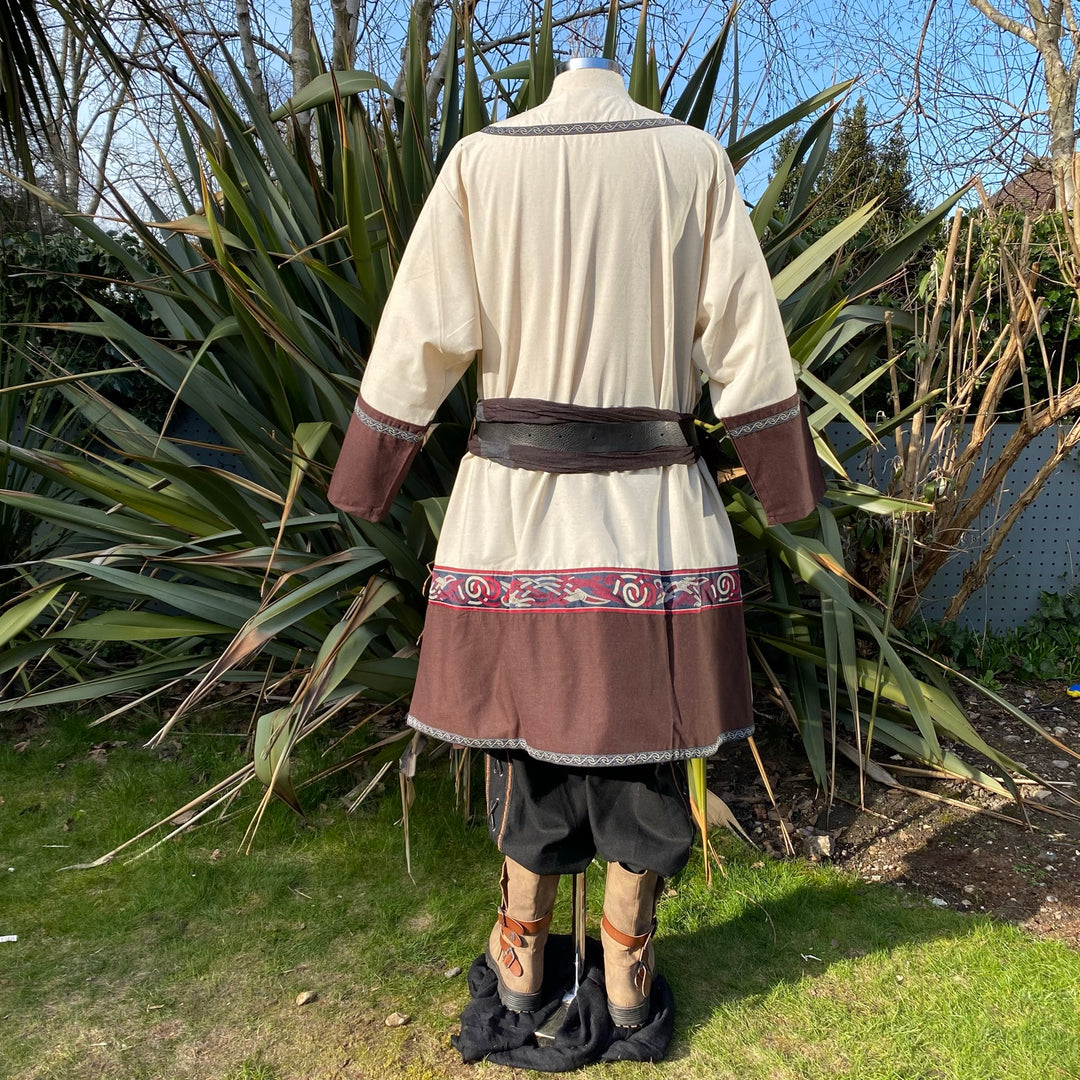 Back view of medieval LARP tunic with brown accents and embroidered trim.