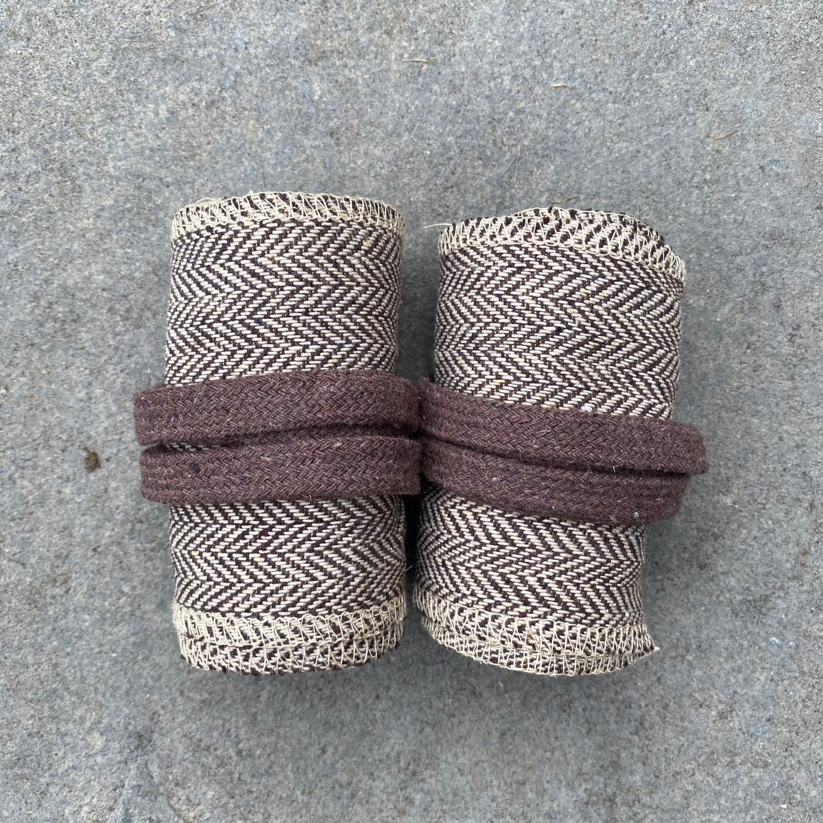 Rolled herringbone wraps in light brown wool for LARP or medieval use.