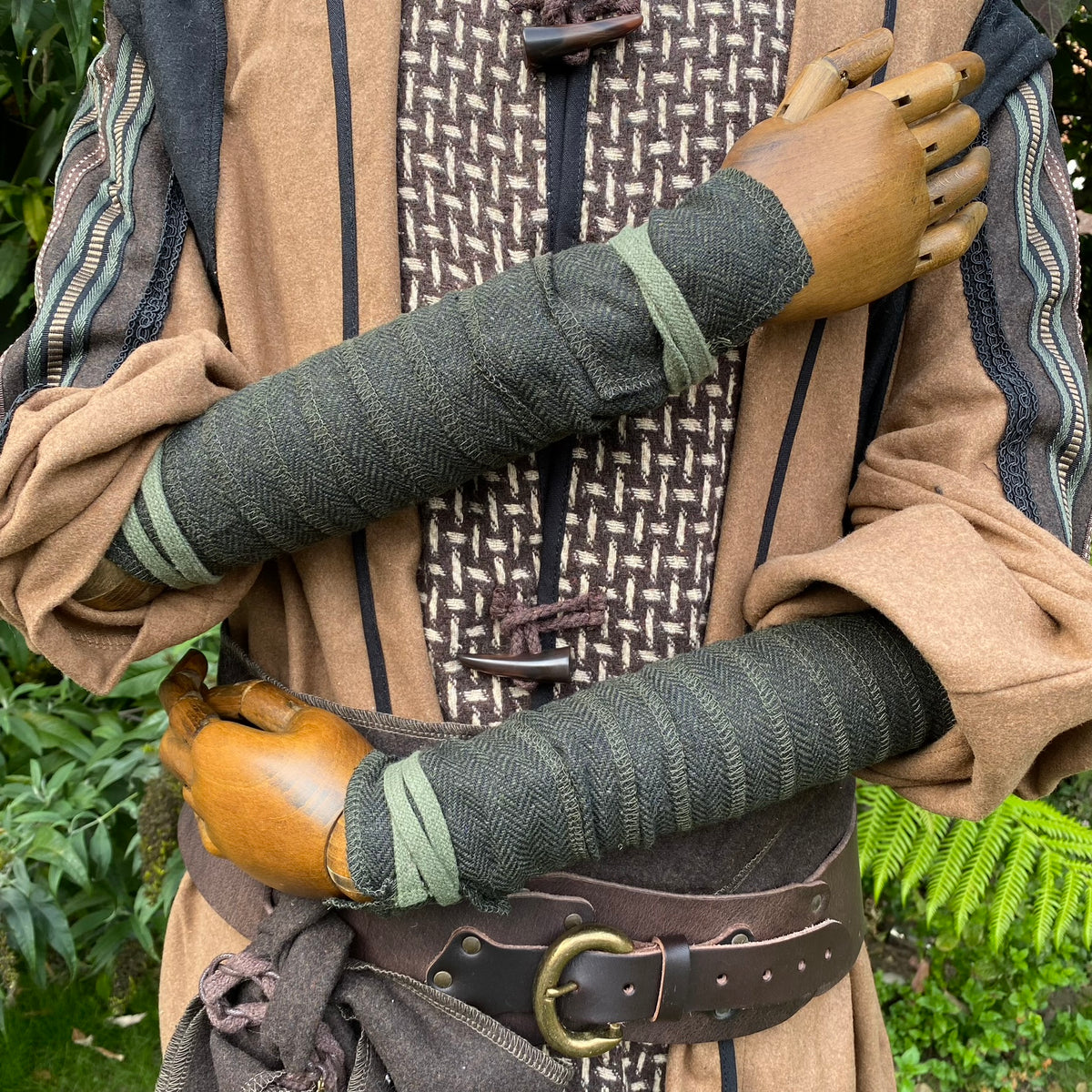 Arm detail of green herringbone wrap set for LARP medieval costume.