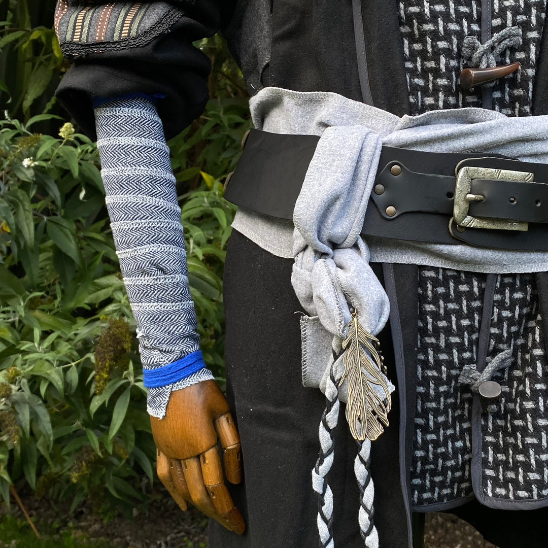 Blue and white herringbone wool wrap on arm, LARP medieval style.