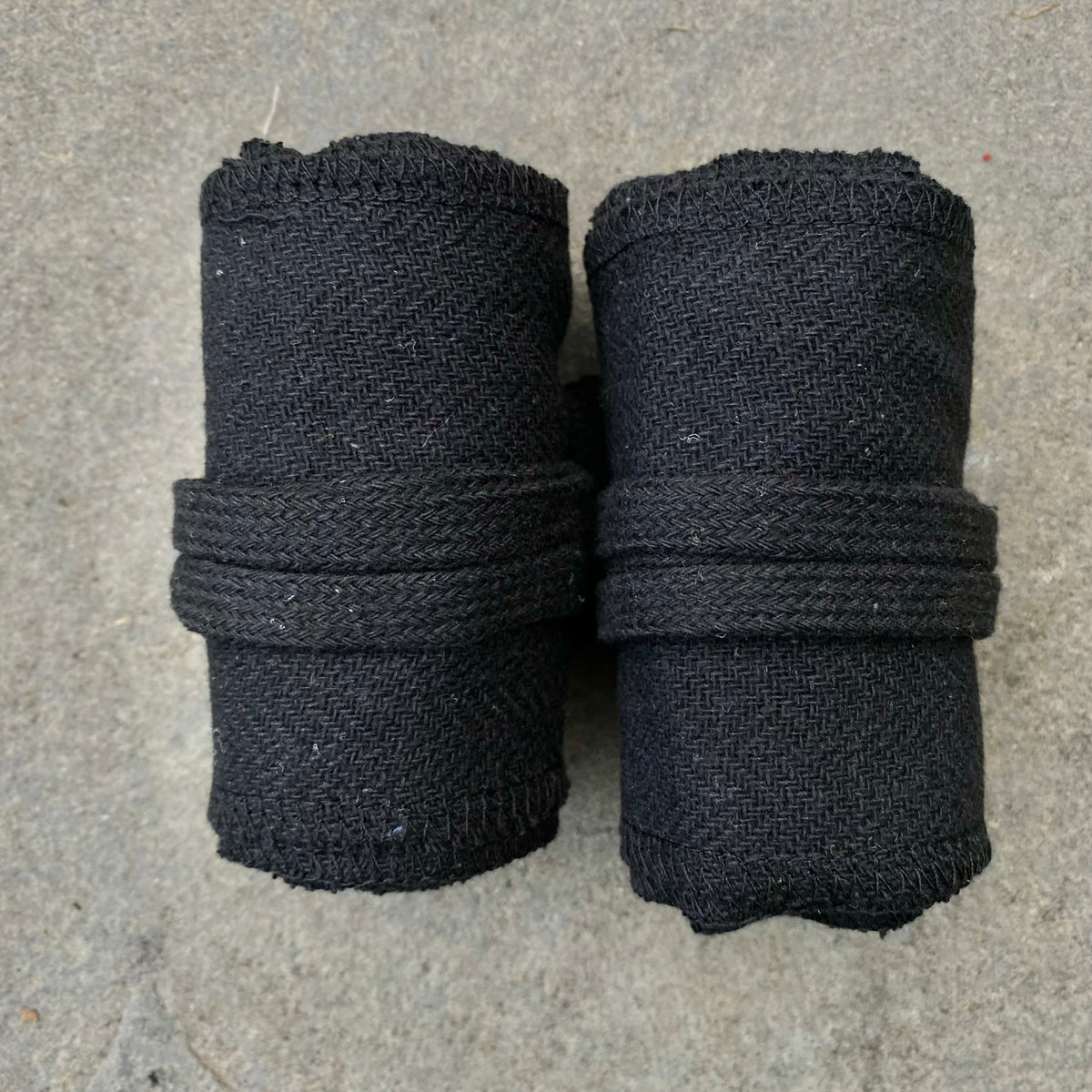 Black herringbone wool leg and arm wraps for LARP or medieval attire.