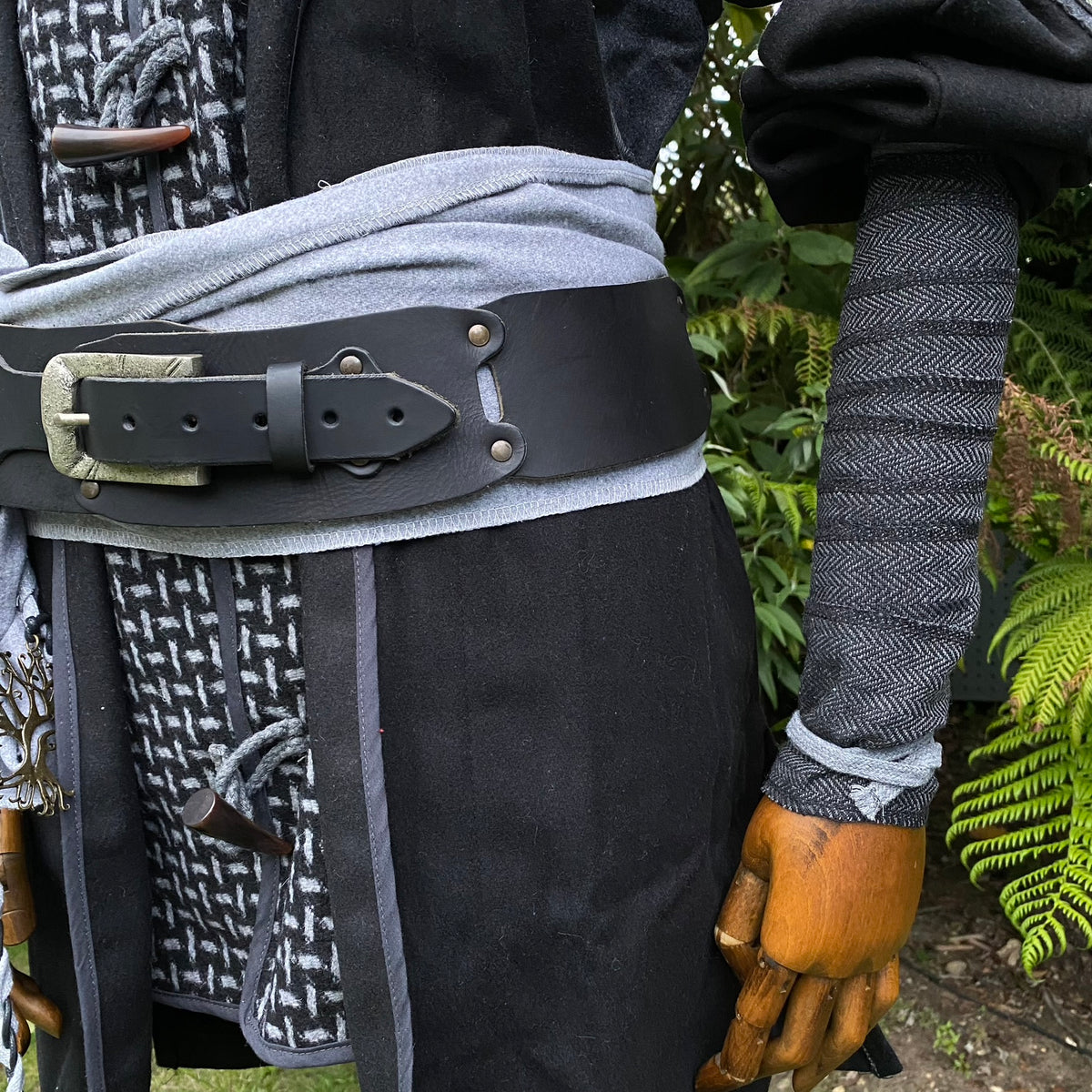 LARP medieval arm wrap detail in grey black herringbone wool with sash belt.