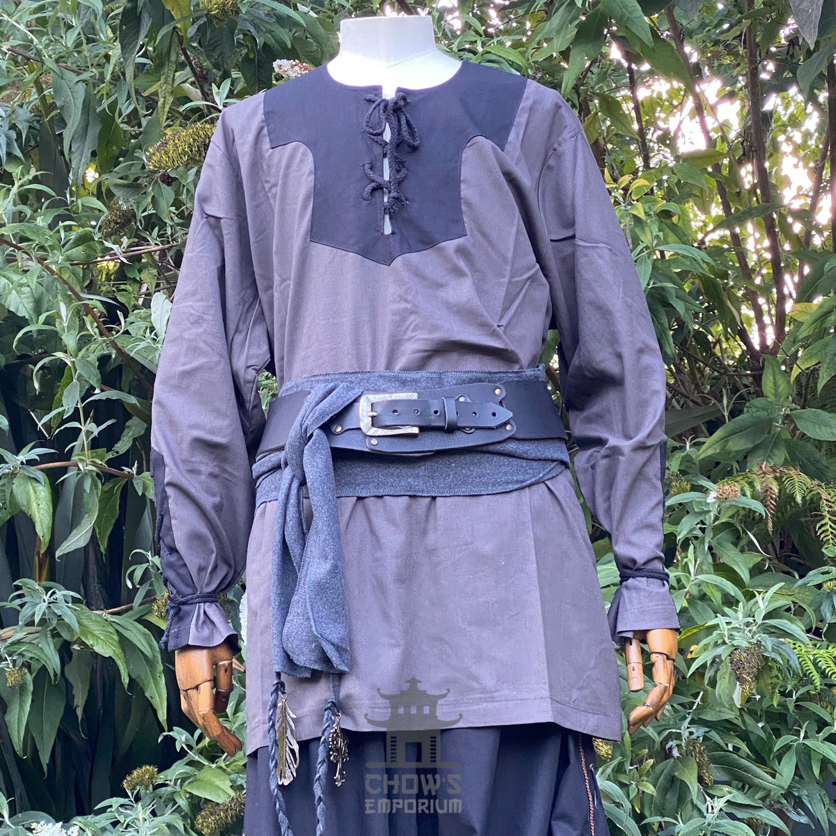 Medieval LARP outfit with sash and waistcoat, displayed on mannequin.