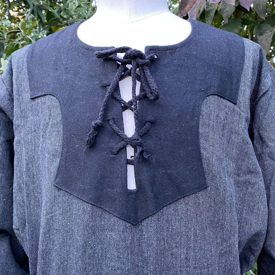 Medieval LARP shirt with black laced neckline detail, close-up view.