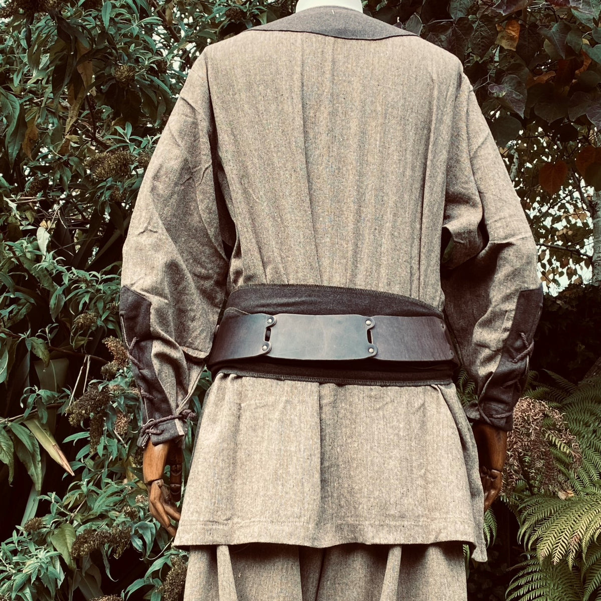 Back view of LARP costume with belt and long sleeves.