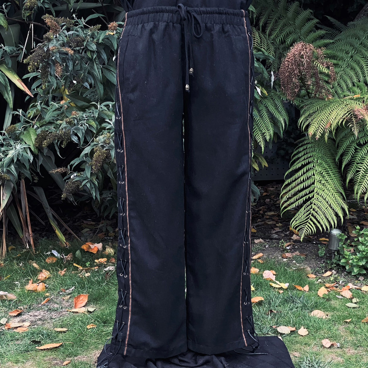 Black wool straight leg pants with side lace, medieval LARP style.