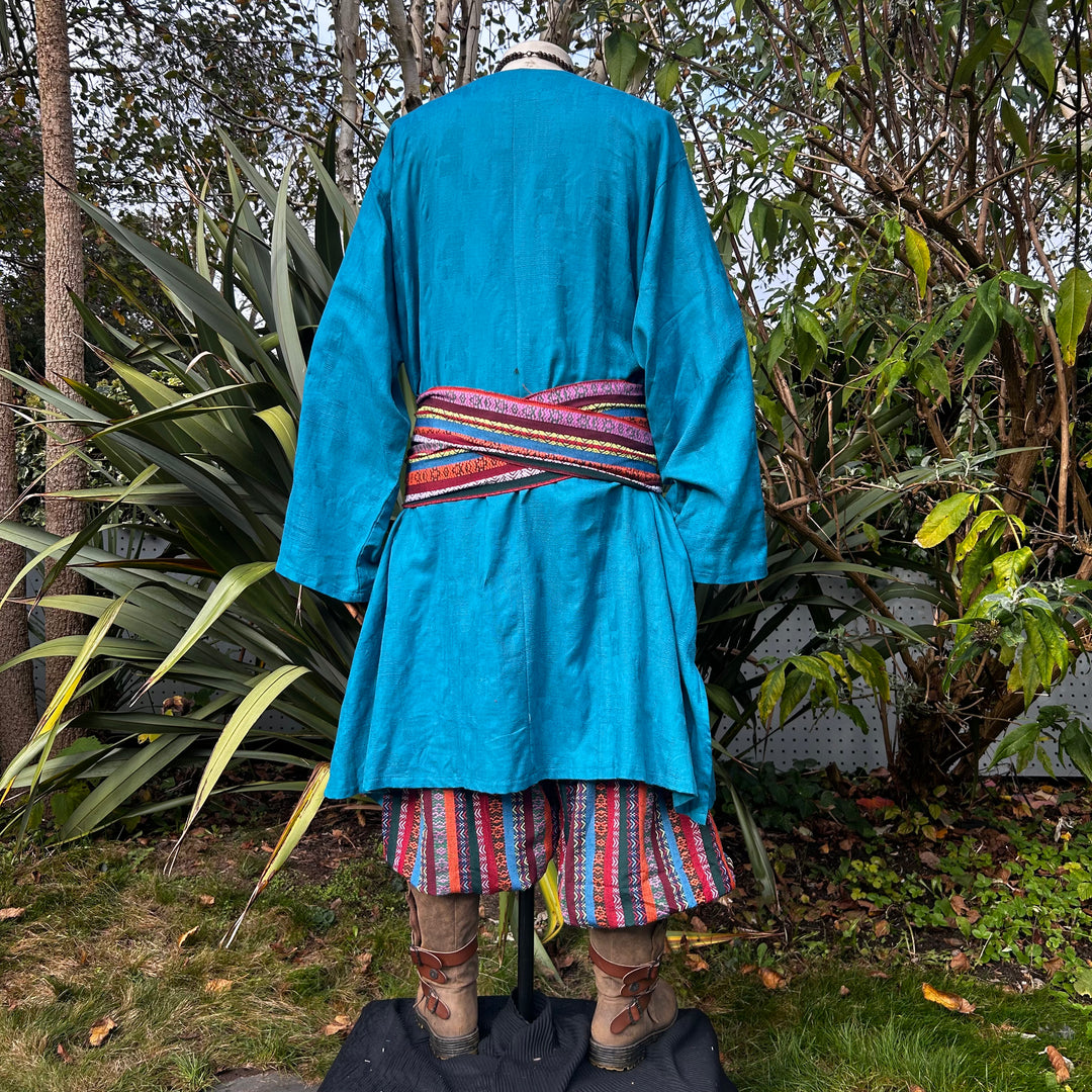 Teal textured tunic, back view, with patterned sash for LARP.