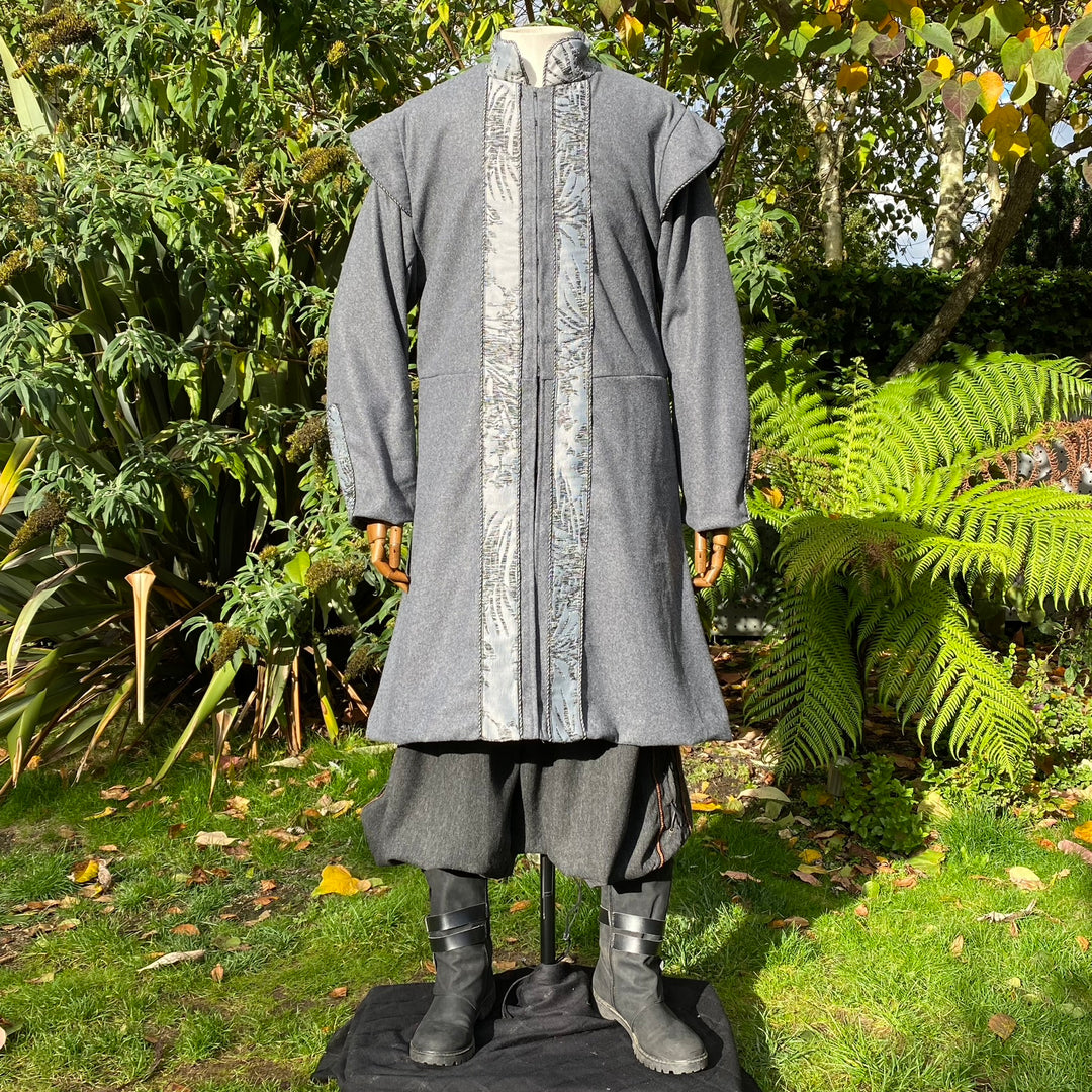 Front view of grey medieval LARP coat with detailed trim.