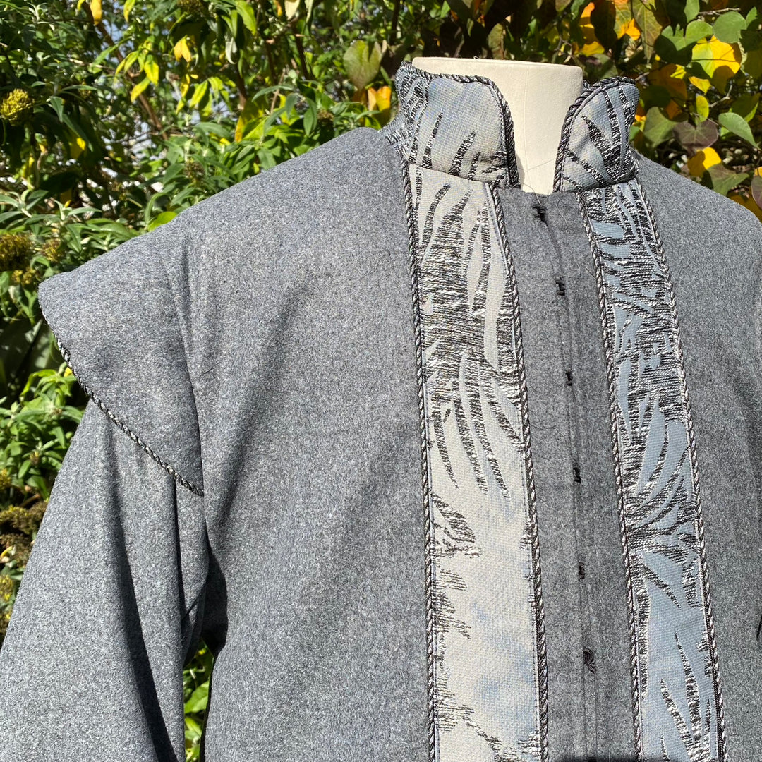 Grey LARP coat with patterned front panel and padded collar.