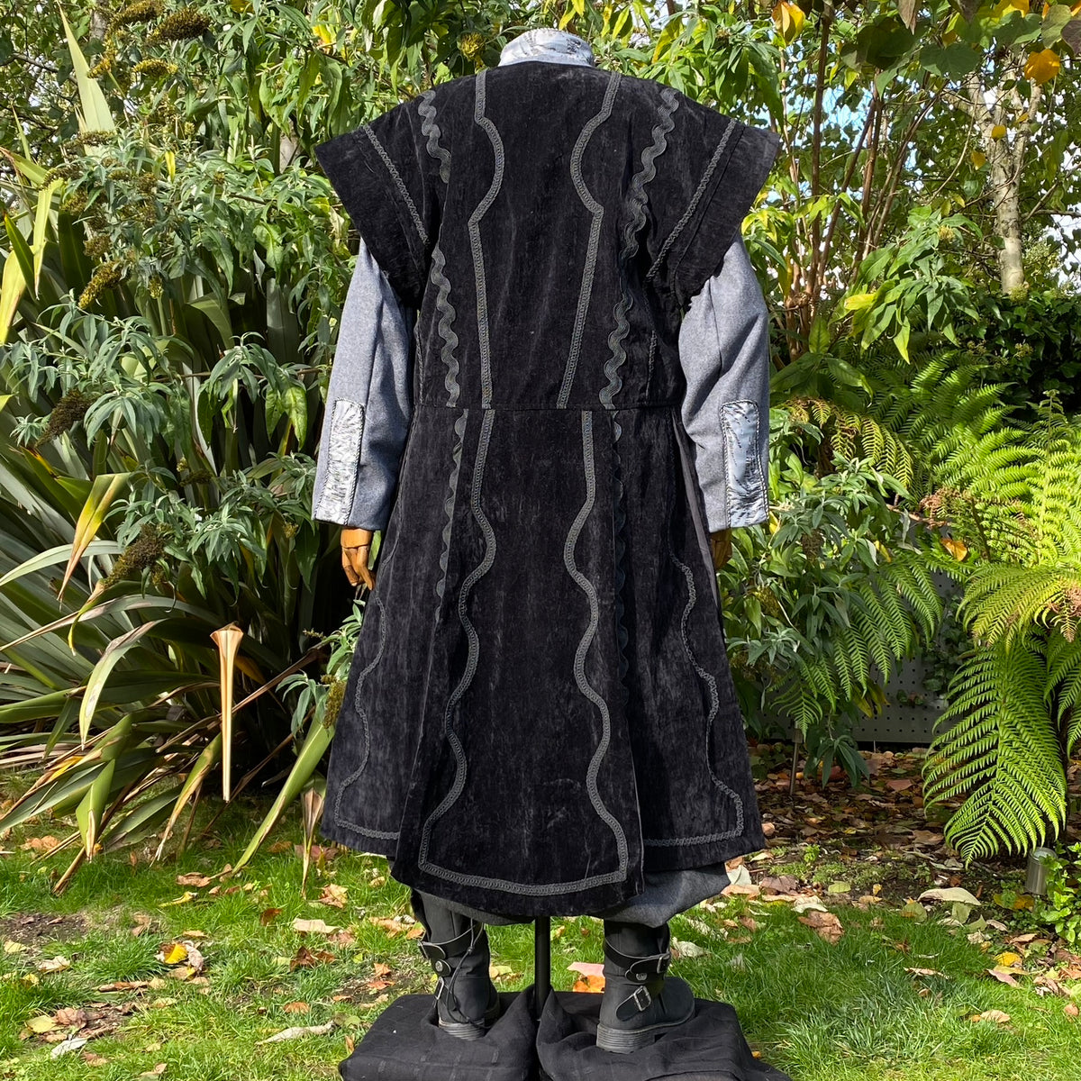 Back view of black suede-effect LARP waistcoat with long flowing panels for fantasy cosplay.