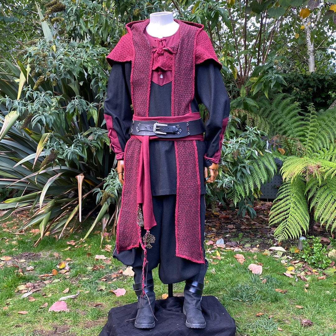 Red wool hood on full medieval costume with black tunic.
