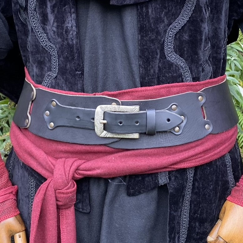 Black velvet cloak with embroidery, red tied shirt, leather belt for LARP events.