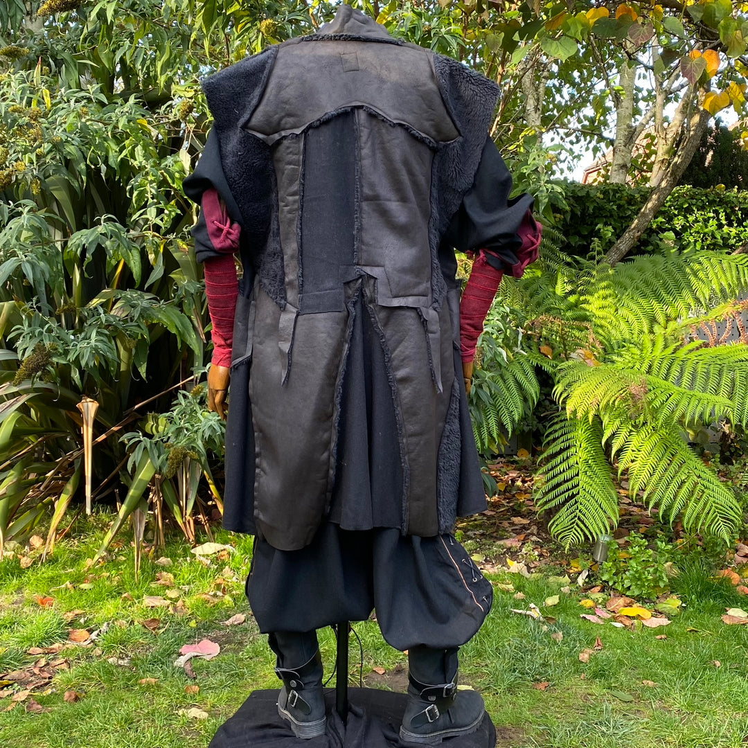 Back view of medieval LARP waistcoat in black faux leather.