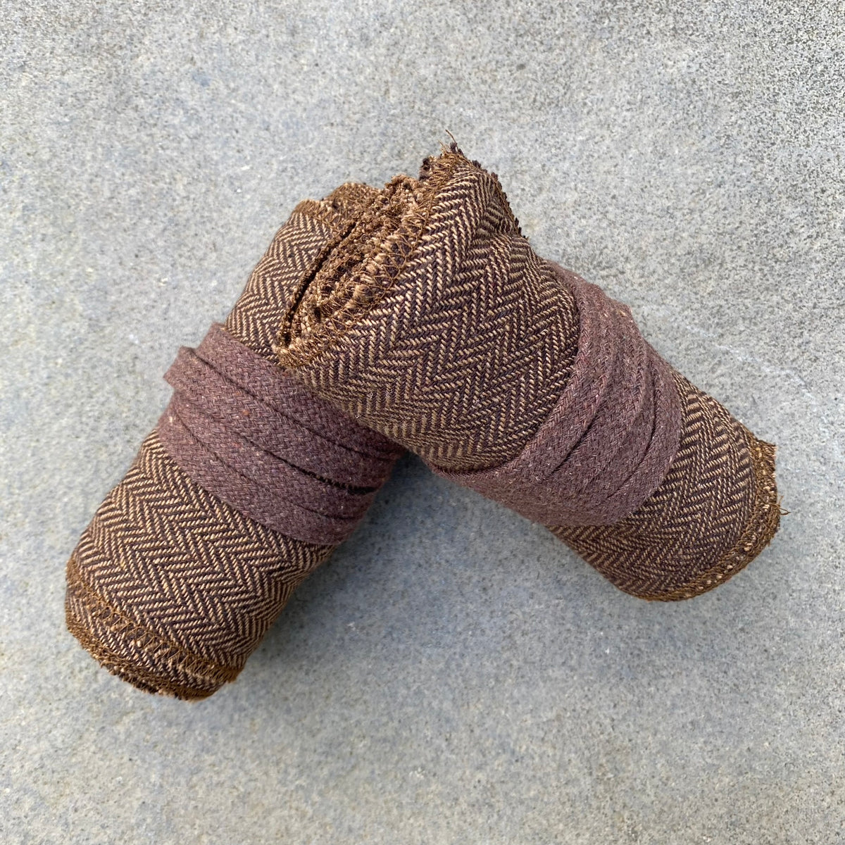 Dark brown herringbone wool leg and arm wraps for LARP or medieval use.