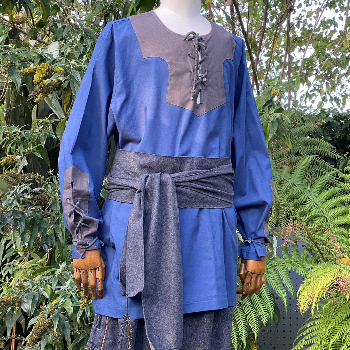 Medieval LARP outfit in blue with grey sash.